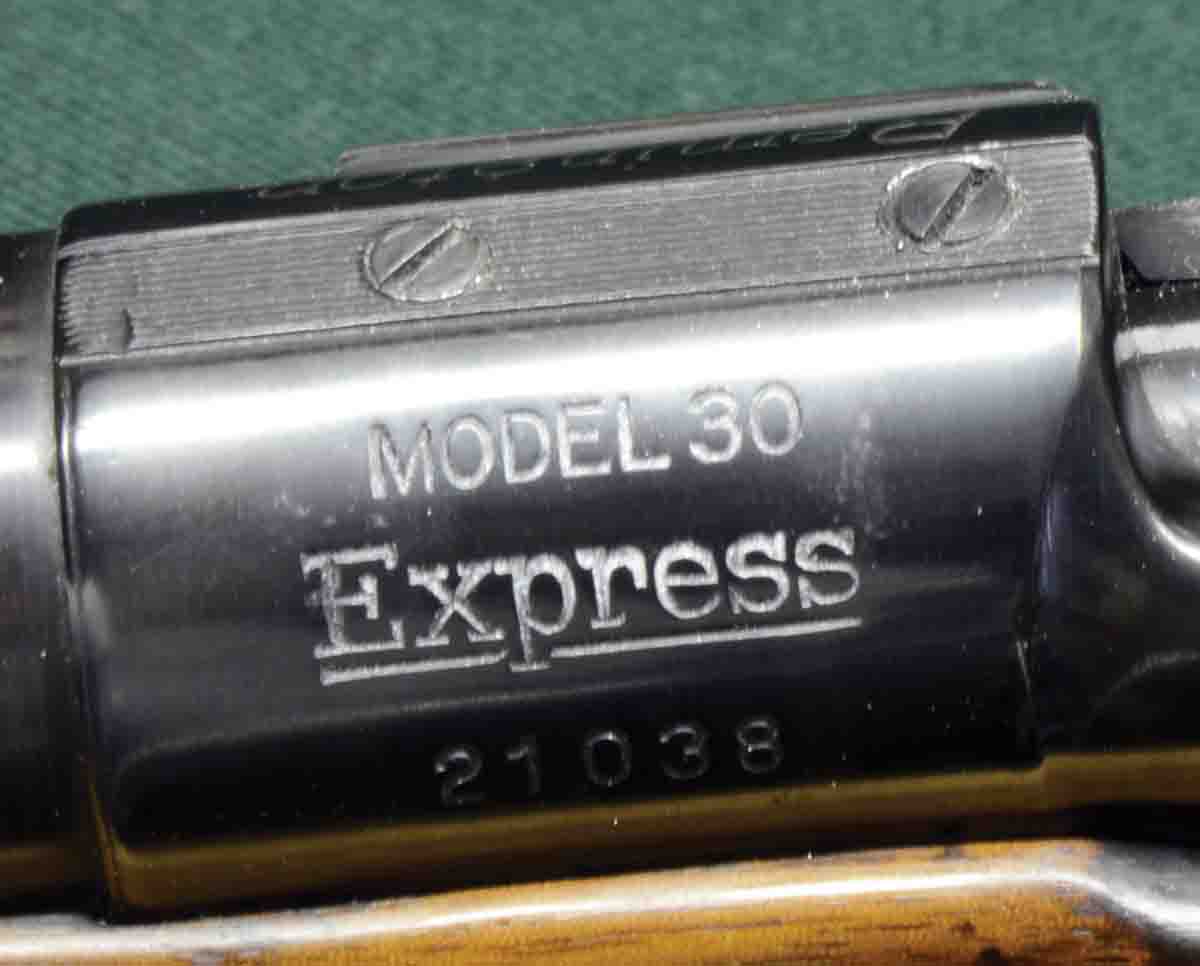 Roll-marking on the left side of the receiver ring. Even though the rifle was built prior the common use of telescopic sights, its receiver ring and bridge were drilled and tapped and headless filler screws were installed.